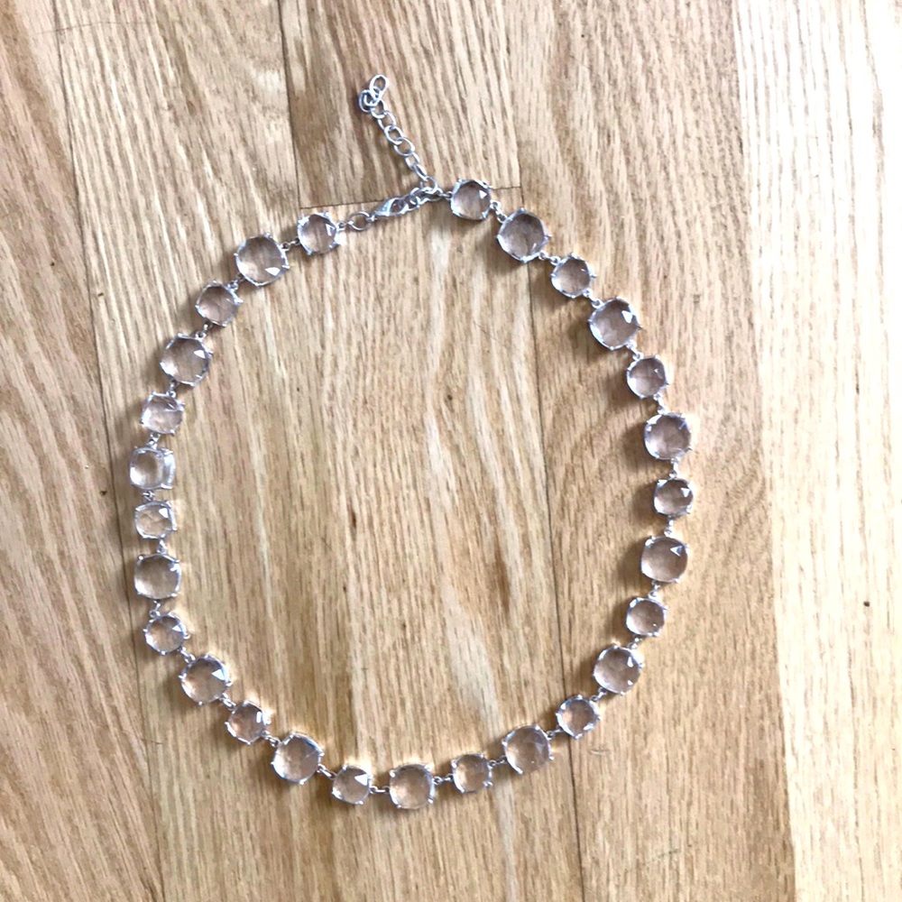 Silver tone and clear glass necklace. Never worn.  pillow shaped beads
